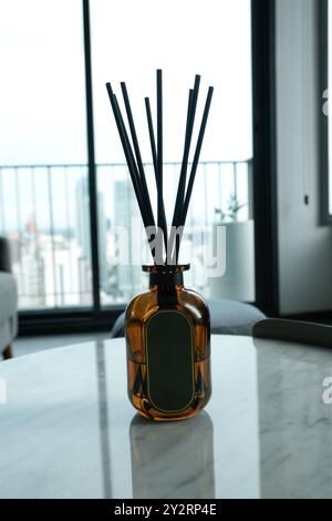 Oil diffuser on a marble table with an empty label Stock Photo