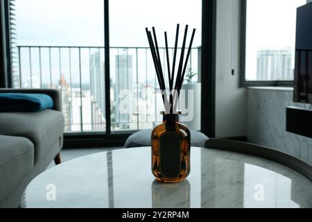Oil diffuser on a marble table with an empty label Stock Photo