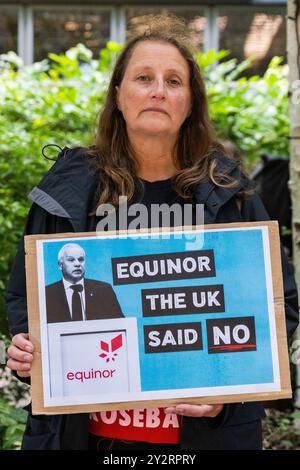 London, UK. 10th September, 2024. A Christian Climate Action activist takes part in a silent vigil outside the UK offices of Equinor to call on the company to abandon plans to develop the Rosebank oil and gas field. On 29th August, the new UK Labour government announced that it will not defend the previous Conservative government’s decision to approve the Rosebank oil field in a court case brought by the Stop Rosebank campaign. Credit: Mark Kerrison/Alamy Live News Stock Photo