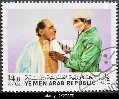 Cancelled postage stamp printed by Yemen, Arab Republic, that shows Professor Barnard and his patient, Heart transplant by Professor Barnard, circa 19 Stock Photo