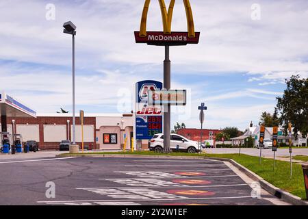 McDonalds Golden Arches sign in front of a JET gas station sign in southern Georgia, USA!! Stock Photo