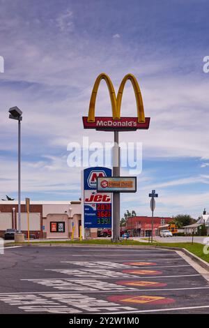 McDonalds Golden Arches sign in front of a JET gas station sign in southern Georgia, USA!! Stock Photo