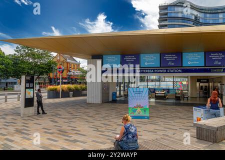 People at the entrance to Battersea Power Station tube station on the Northern Line, the terminus of the Northern line extension to Battersea, London Stock Photo