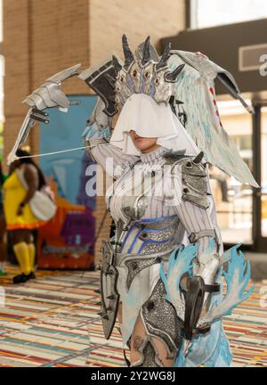 A person dressed in Xeno'jiva armor from Monster Hunter at ConnectiCon convention center in Hartford, Connecticut Stock Photo