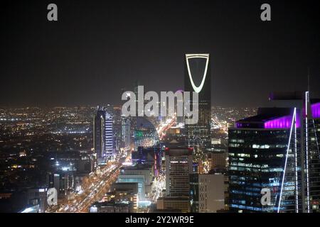 Riyadh, Saudi Arabia – September 11, 2024: Central Riyadh at night, with the Kingdom Tower rising above the city Stock Photo