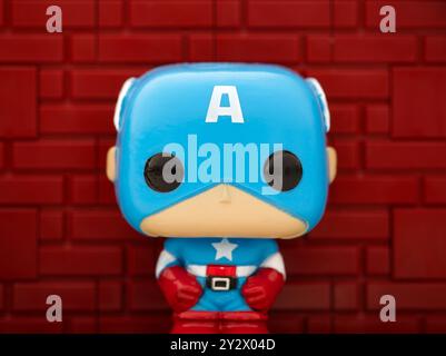 Tambov, Russian Federation - August 23, 2024 Captain America Funko POP Mini Vinyl Figure against a red brick wall background. Stock Photo