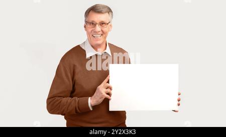Smiling Senior Man Holding Blank Poster Standing, White Background, Panorama Stock Photo