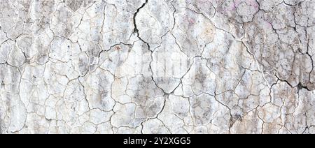 abstract line pattern on white painted part of conrete with cracks Stock Photo