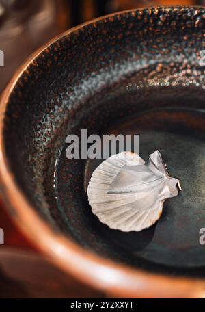 Baptism Shell Symbol and Holy Water Stock Photo