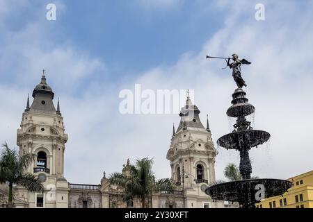 Detail of Plaza Mayor in Lima’s historic center, featuring the central fountain in the foreground and the cathedral in the background Stock Photo