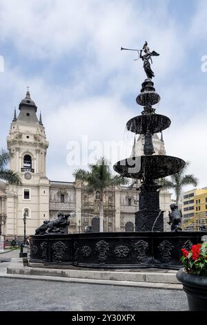 Detail of Plaza Mayor in Lima’s historic center, featuring the central fountain in the foreground and the cathedral in the background Stock Photo