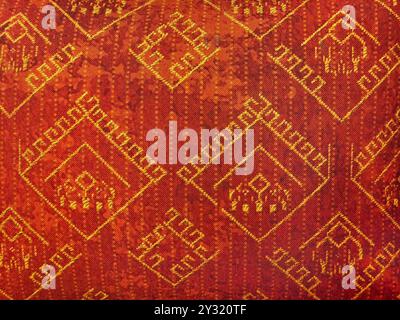 Red ethnic fabric seamless texture in random pattern. Upholstery pillow cover. Stock Photo
