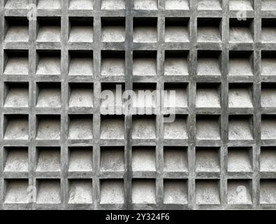 Concrete white roster or breeze block or breeze wall, in a square molding pattern. This breeze block is often applied at building façade. Stock Photo