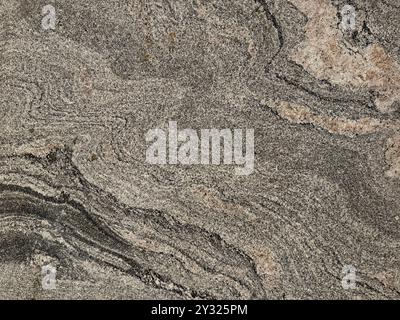 Close up texture of natural stone granite slab pattern in marble looking veining and grains, Seamless texture Stock Photo