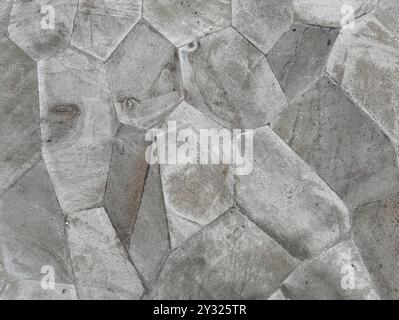 Close up photo of random cut cobble stone slab, natural grey and dark grey cobble stone seamless texture as flooring for outdoor parks. Stock Photo