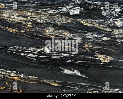 Exotic Nero Volcano marble seamless texture. Or Belvedere Granite natural slab tiles in Black, white, and golden yellow vein color. Seamless texture. Stock Photo