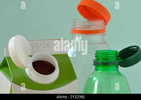 Close-up of caps attached to the neck of bottles - Concept of ecology and environmental conservation Stock Photo