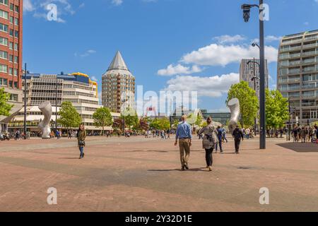 Rotterdam, The Netherlands - May 27, 2022: People walking on the Binnenrotte at Blaak station, Rotterdam. In the background, Willemsbrug, De Potlood, Stock Photo