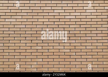 Seamless beige brick wall texture with horizontal rectangular bricks. Background Stock Photo