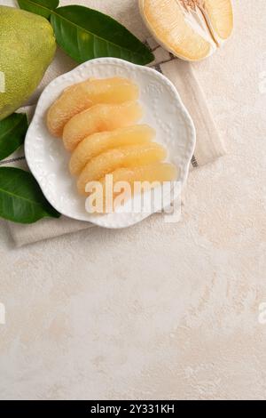 Fresh peeled pomelo with leaf on white table background for Mid-Autumn Festival fruit. Stock Photo