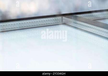 Wienersprossen is insulating double glazing, with metal spacers installed in the space between the two glass sheets. Rods will be added later Stock Photo