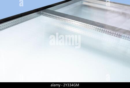Wienersprossen is insulating double glazing, with metal spacers installed in the space between the two glass sheets. Rods will be added later Stock Photo