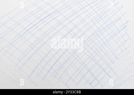 Blue pencil scribbles in lattice shape on white paper background Stock Photo