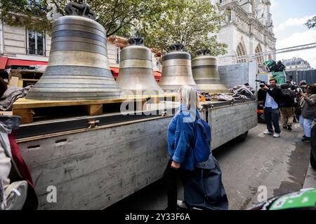 Eight bells return to the north belfry of Notre-Dame de Paris cathedral, central Paris, France on September 12, 2024. From "Gabriel", weighing over four tonnes, to the smaller "Jean-Marie", named in tribute to Cardinal Lustiger: on September 12, Notre-Dame de Paris welcomes back the eight bells in its northern belfry, less than three months before the cathedral reopens. These eight bells, bearing the names of personalities who have marked the life of the diocese and the Church, were removed in July 2023 to allow the restoration of the north tower, which was affected by the flames of the giant Stock Photo