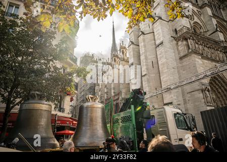 Eight bells return to the north belfry of Notre-Dame de Paris cathedral, central Paris, France on September 12, 2024. From "Gabriel", weighing over four tonnes, to the smaller "Jean-Marie", named in tribute to Cardinal Lustiger: on September 12, Notre-Dame de Paris welcomes back the eight bells in its northern belfry, less than three months before the cathedral reopens. These eight bells, bearing the names of personalities who have marked the life of the diocese and the Church, were removed in July 2023 to allow the restoration of the north tower, which was affected by the flames of the giant Stock Photo