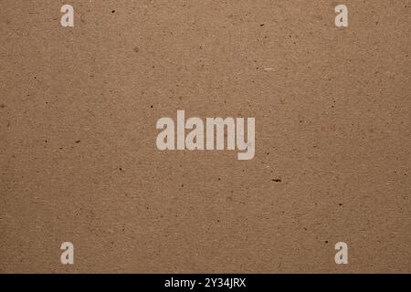 Brown craft cardboard. Cardboard texture, abstract background. Stock Photo