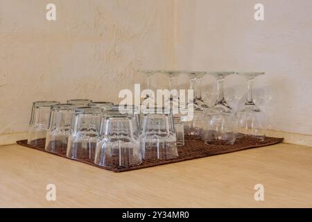 lot of empty glasses on the reception party table. Close up at row of glasses prepare to service for dinner party Stock Photo