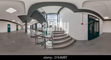 hdri 360 panorama on emergency and evacuation exit stairs in empty modern hall with columns, doors and panoramic windows in office building in spheric Stock Photo