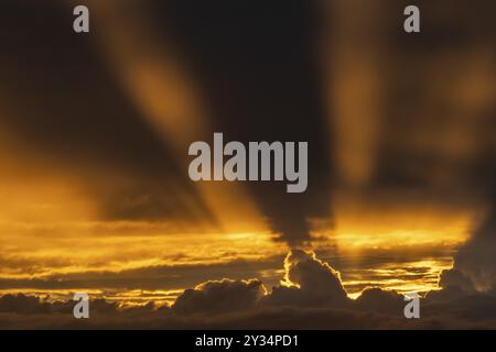 Rays of sunshine penetrate from behind storm clouds, dramatic lighting mood, Germany, Europe Stock Photo