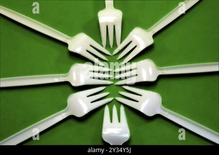 Fork white with plastic snack bar on green bottom Stock Photo