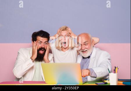Surprised business people working as a team at the office. Shocked group of business people. Businesspeople sharing their ideas. Shocked Business team Stock Photo