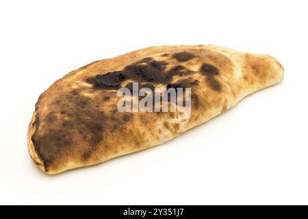 Baked in calzone, closed type of pizza which is folded in half on a white background Stock Photo