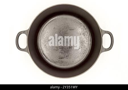 Cast iron pan with two handles top view on a white background Stock Photo