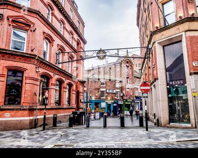 Street scene image on Mathew Street in Liverpool's Cavern Quarter where the Beatles pop group established themselves in the 1960's Stock Photo