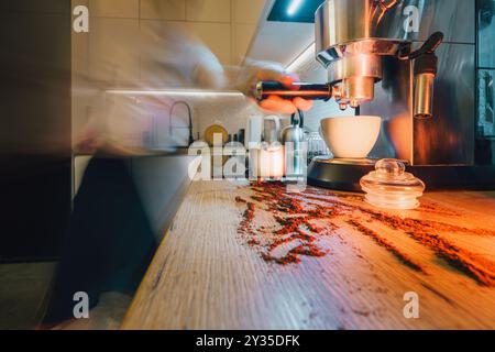 Preparing coffee in the kitchen. Home interior. Motion blur. Stock Photo