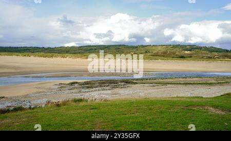 The estuary where the Ogmore River (Afon Ogwr) meets the Bristol Channel. Take as the hide tide was receding, on a late afternoon in late summer. Stock Photo