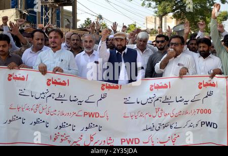 Employees of Public Works Department (PWD) are holding protest demonstration against abolishment of PWD, at Peshawar press club on Thursday, September 12, 2024. Stock Photo