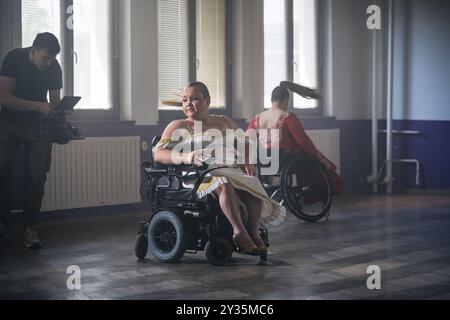 Para dance sport, two determined women with disability enjoy practicing elegant and stylish movements on wheelchair. Stock Photo