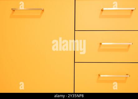 composition of a modern piece of furniture in orange color Stock Photo