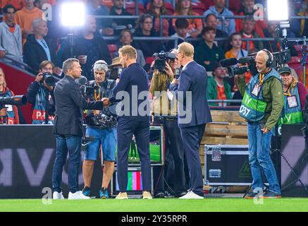 DFB headcoach Julian Nagelsmann , Bundestrainer, Nationaltrainer TV interview with Norbert König, Lothar Matthäus TV co-presenter,  in the UEFA Nations League 2024 match NETHERLANDS - GERMANY  2-2  in Season 2024/2025 at Sept 10, 2024  in Amsterdam, NL.  Photographer: Peter Schatz Stock Photo