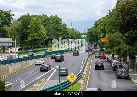 Automobiles travel along Storrow Drive, a major crosstown artery in Boston that is separated from the Charles River by The Esplanade, a park that hugs Stock Photo