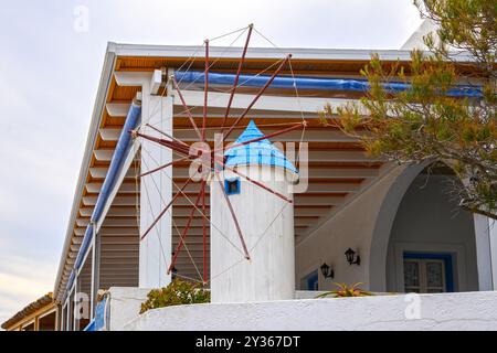 A small windmill in Cycladic style on street in Tholaria village. Amorgos, Greece Stock Photo