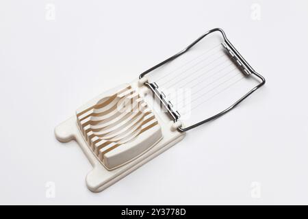 Egg Slicer kitchen utensil on white background Stock Photo