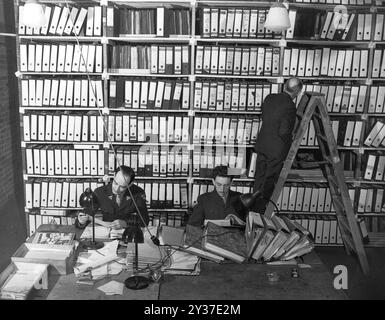 American researchers at the Berlin Document Center peruse captured German records that are to be used as evidence in the war crimes trials. The Nuremberg Trials was a series of trials of major nazi military and political leaders. The trials took place from 1945 to 1949. The first was the International Military Tribunal which tried the big names like Göring, Ribbentrop, Keitel, etc. There were a subsequent 12 trials of groups of men including doctors, the Einsatzgruppen and military high command. Stock Photo