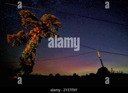 Doddiscombsleigh, Devon, UK. 13th Sep, 2024. Northern lights in the night sky over Doddiscombsleigh, Devon, UK. Aurora Borealis. Credit: nidpor/Alamy Live News Stock Photo