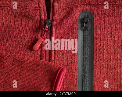 close up of red zipper on jacket with red zipper Stock Photo